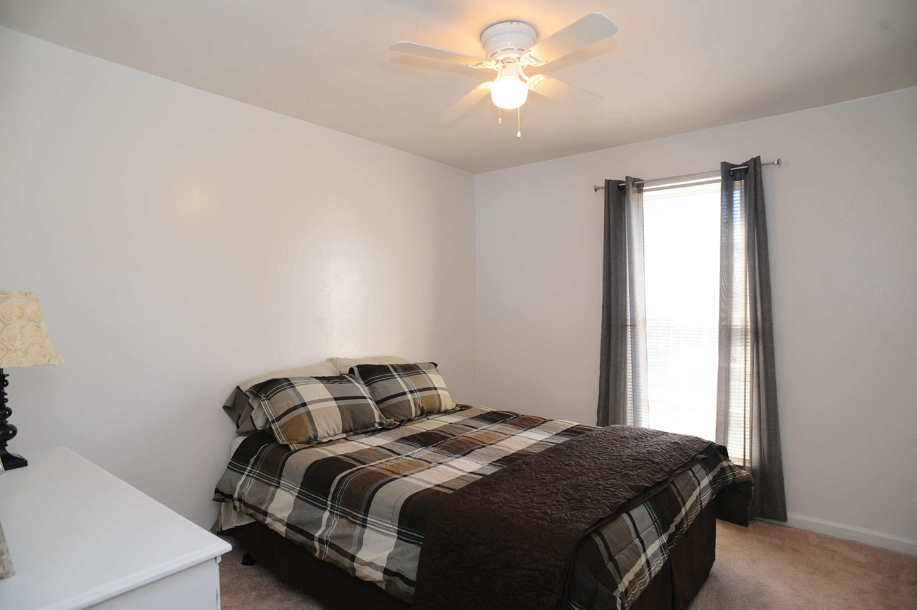 265 Northridge Road Hardy, VA 24101 - Photo 27 of 59 a bedroom with a bed and a chandelier