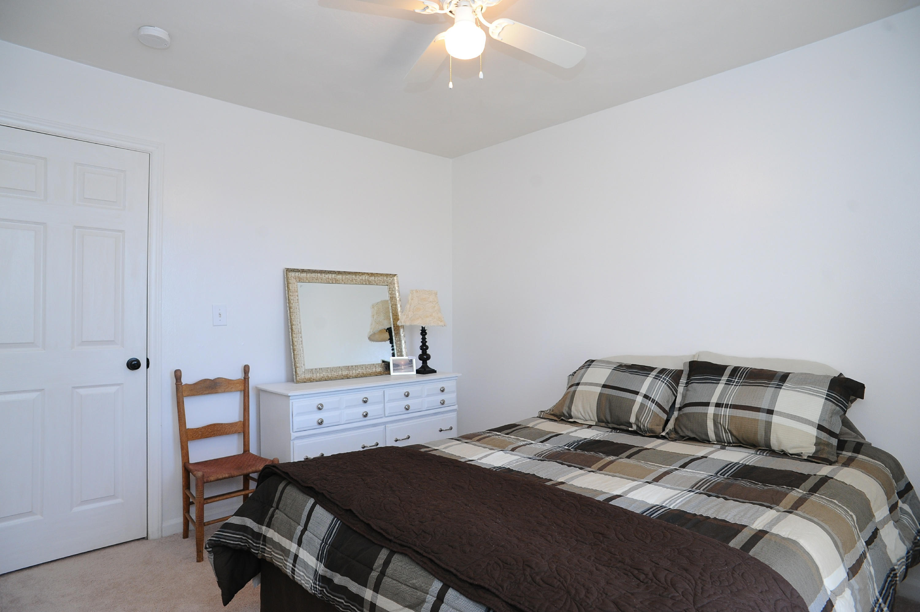 265 Northridge Road Hardy, VA 24101 - Photo 28 of 59 a bedroom with a bed and a chandelier