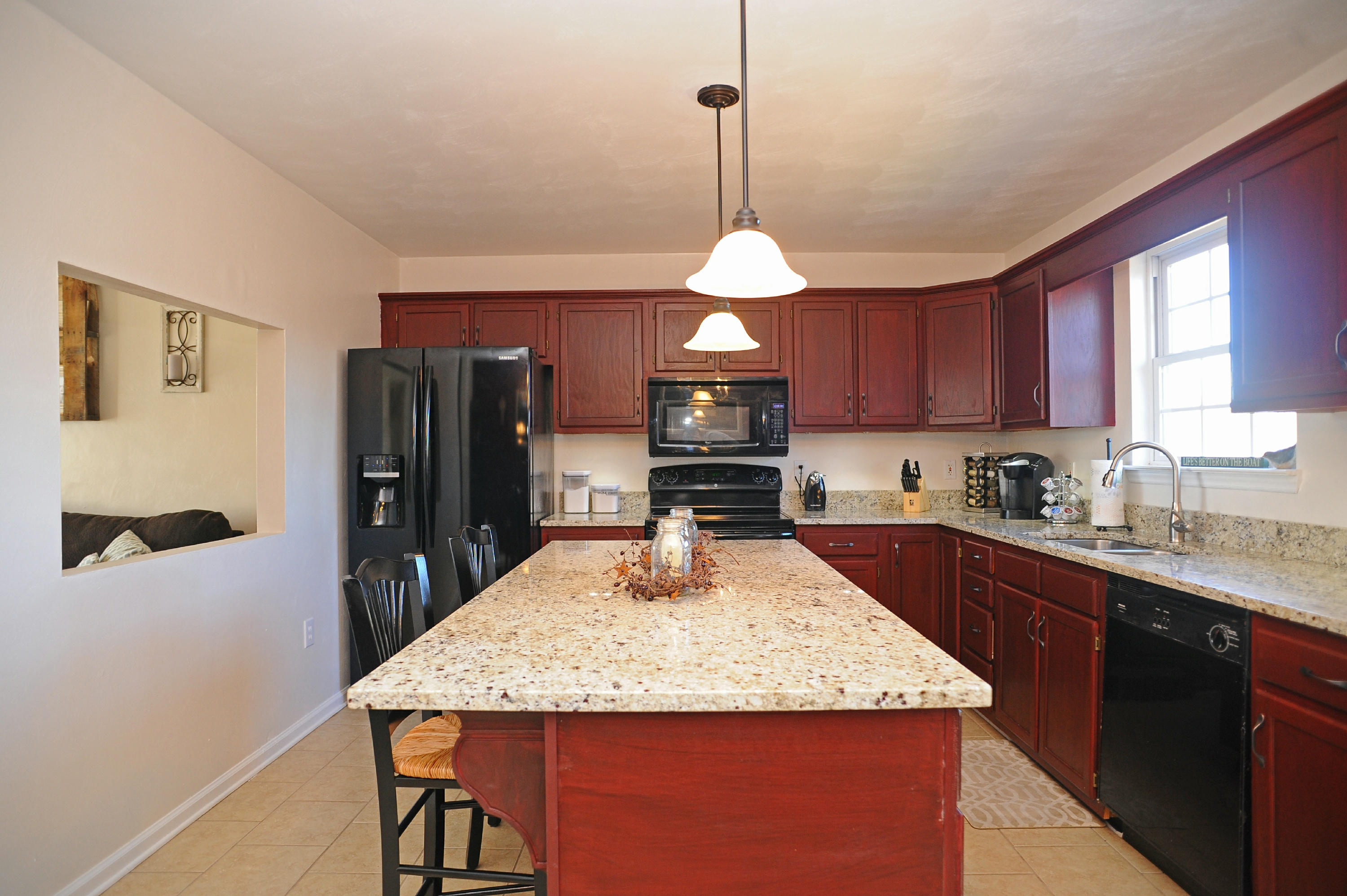 265 Northridge Road Hardy, VA 24101 - Photo 6 of 59 a kitchen with stainless steel appliances granite countertop a sink refrigerator stove and microwave