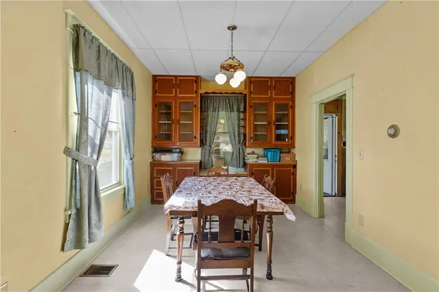 a dining room with a table and chairs