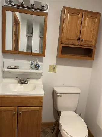 a bathroom with a shower and a sink