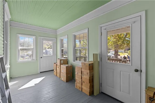 an empty room with a empty space and windows