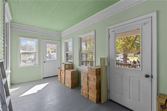 an empty room with a empty space and windows