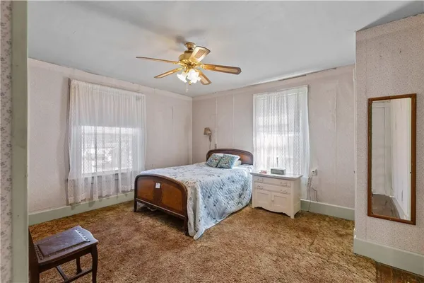 a view of room with walk in closet and bedroom