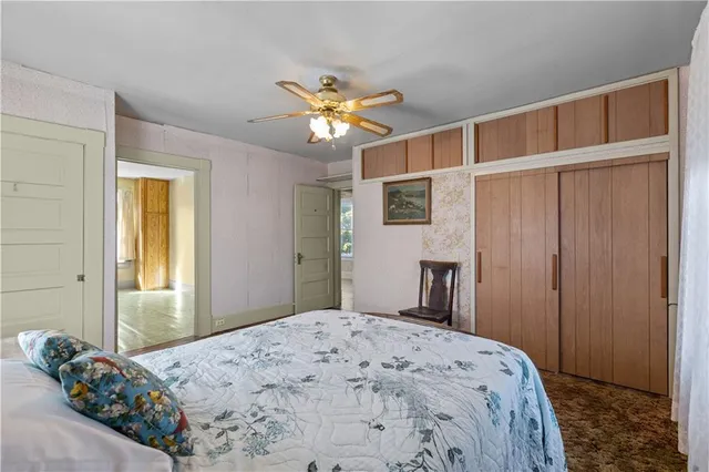 a bedroom with a bed and a dresser