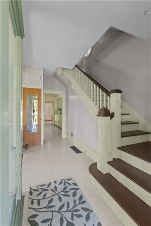 a view of entryway and hall with a rug