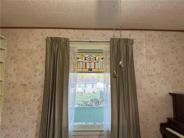 a view of a livingroom with furniture and windows