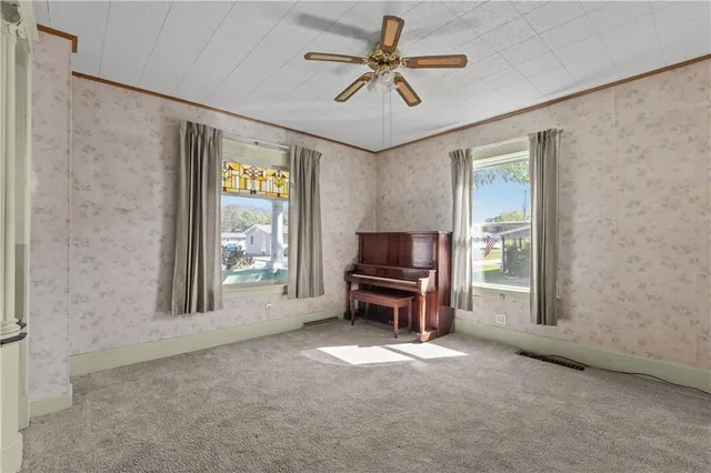 a view of an empty room with a window