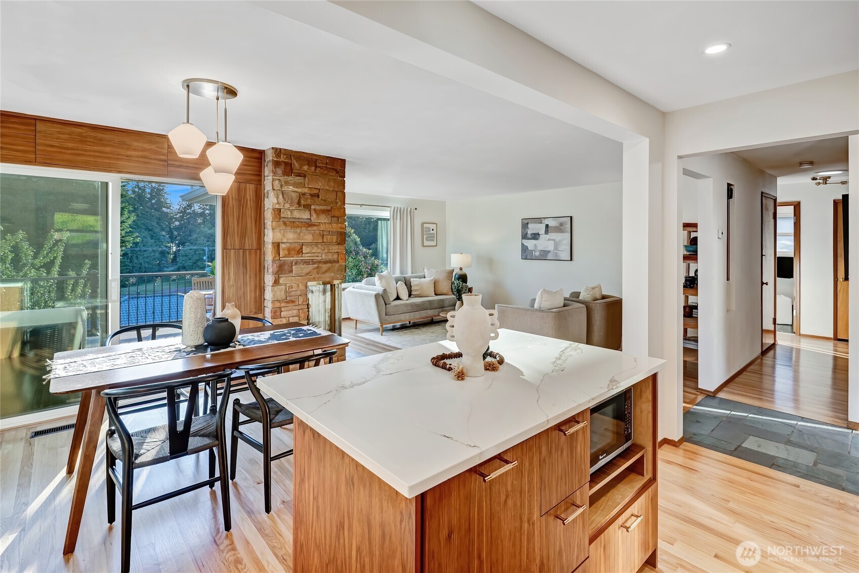 7571 45th Avenue Southwest Seattle, WA 98136 - Photo 18 of 40 a view of a dining room with furniture window and wooden floor