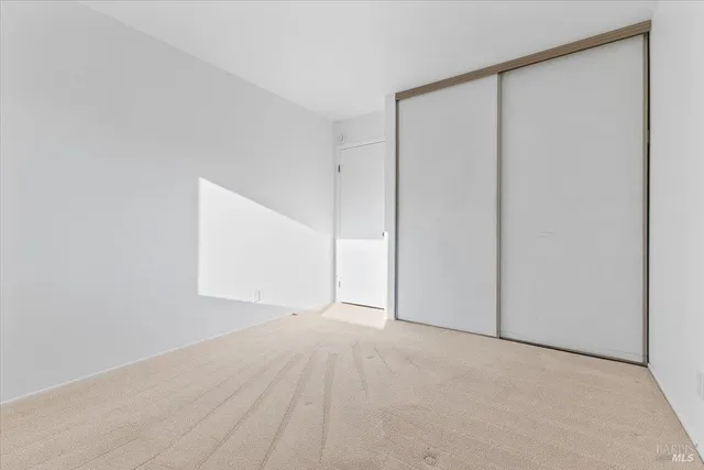 a bathroom with a granite countertop sink a mirror and vanity