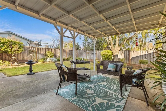 a view of a backyard with potted plants