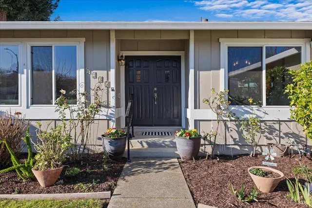 a front view of a house with outdoor seating