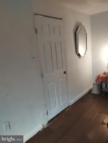 a room with a mirror and a fan