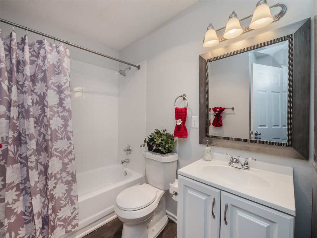 1740 Timber Ridge Road, Unit 132 Austin, TX 78741 - Photo 12 of 26 a bathroom with a sink vanity mirror and toilet