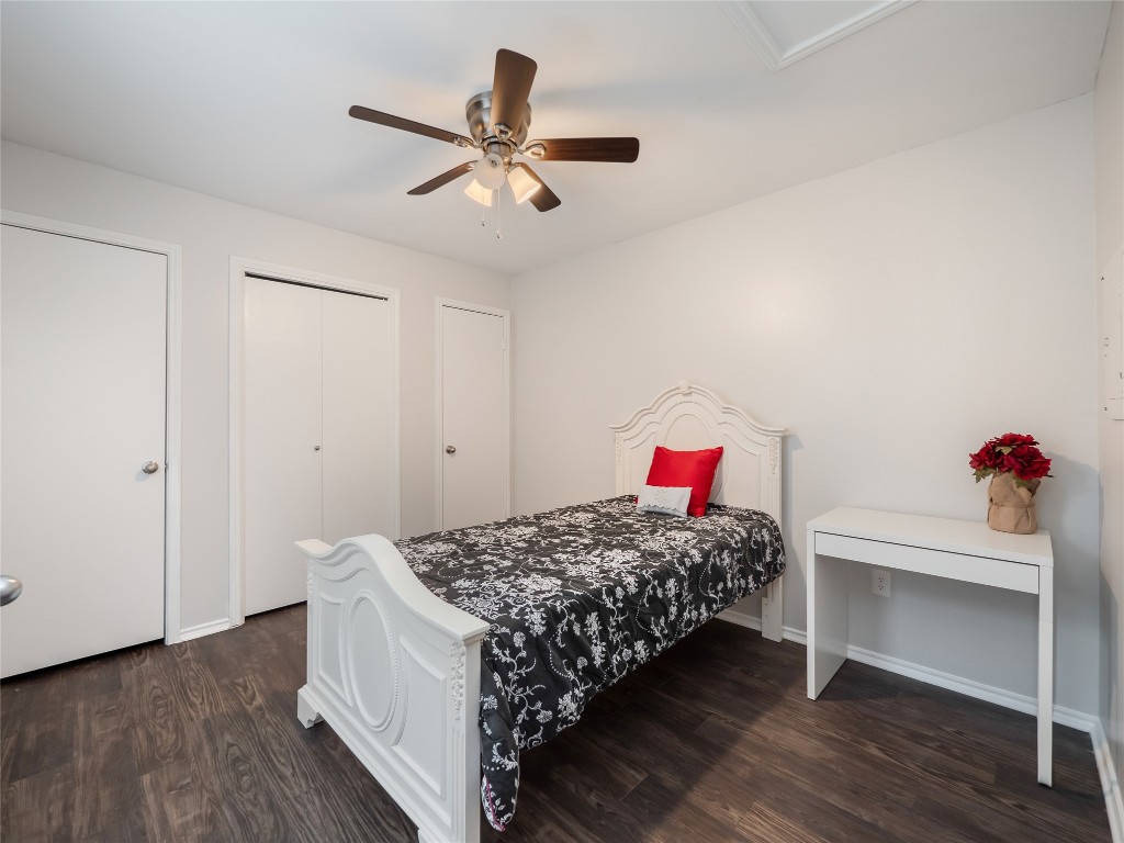 1740 Timber Ridge Road, Unit 132 Austin, TX 78741 - Photo 14 of 26 a bedroom with a bed and a dresser