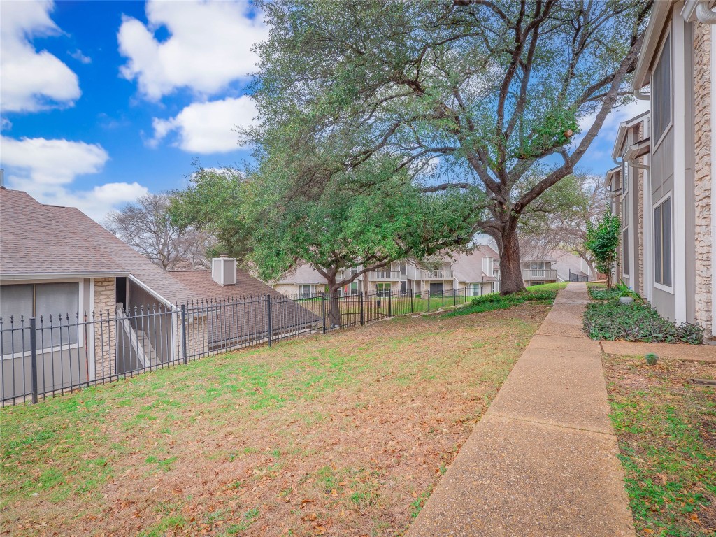 1740 Timber Ridge Road, Unit 132 Austin, TX 78741 - Photo 21 of 26 a view of a house with a yard and tree
