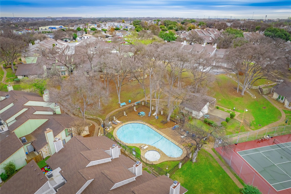 1740 Timber Ridge Road, Unit 132 Austin, TX 78741 - Photo 25 of 26 an aerial view of a house with a swimming pool