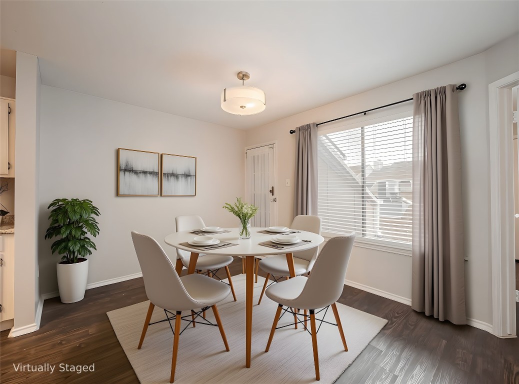1740 Timber Ridge Road, Unit 132 Austin, TX 78741 - Photo 6 of 26 a view of a dining room with furniture window and wooden floor