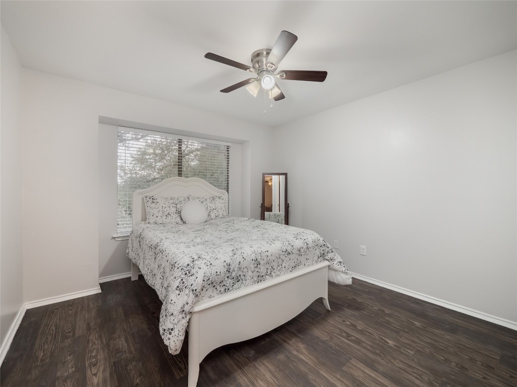 1740 Timber Ridge Road, Unit 132 Austin, TX 78741 - Photo 10 of 26 a bed room with a bed and window