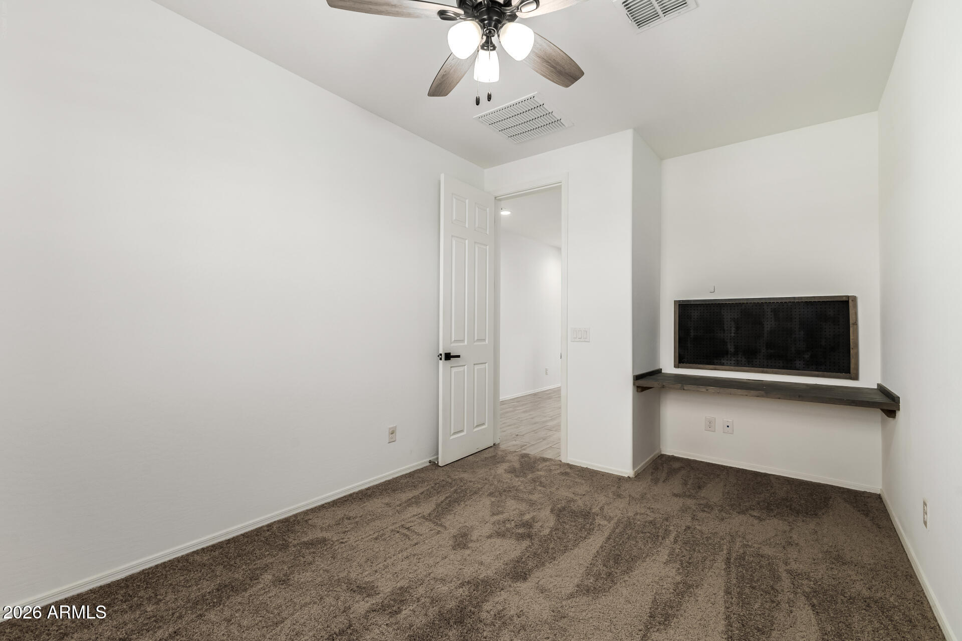 44157 West Palo Olmo Road Maricopa, AZ 85138 - Photo 14 of 34 a view of a livingroom with a flat screen tv