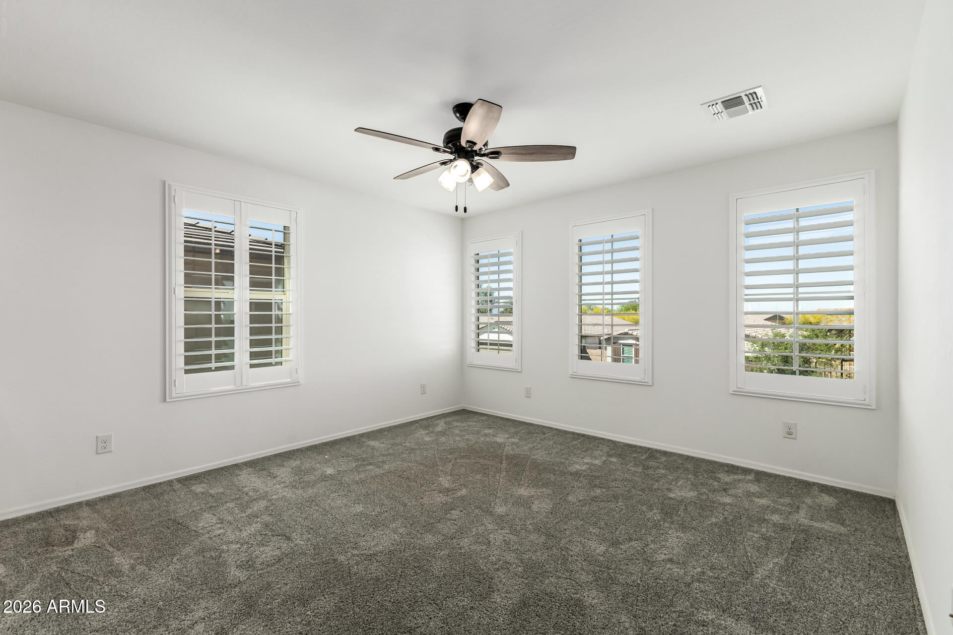 44157 West Palo Olmo Road Maricopa, AZ 85138 - Photo 15 of 34 a view of an empty room with a window