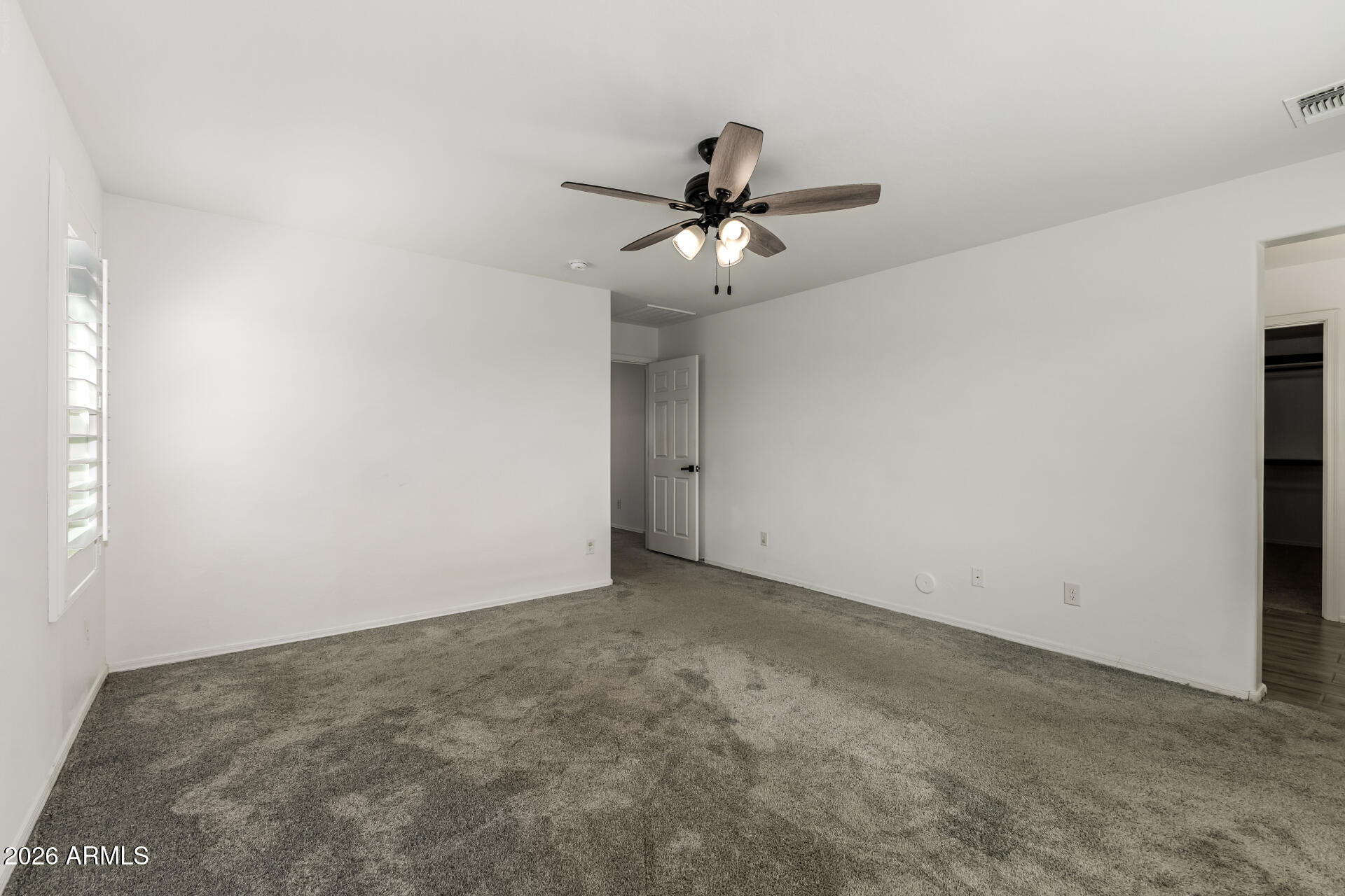 44157 West Palo Olmo Road Maricopa, AZ 85138 - Photo 17 of 34 a view of a big room with carpet