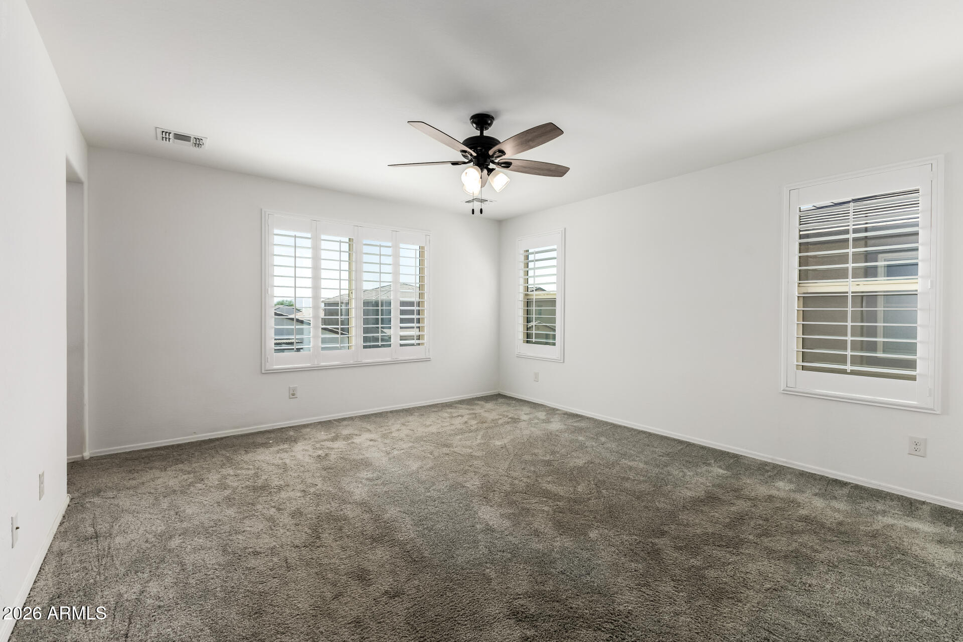 44157 West Palo Olmo Road Maricopa, AZ 85138 - Photo 18 of 34 wooden floor in an empty room with a window