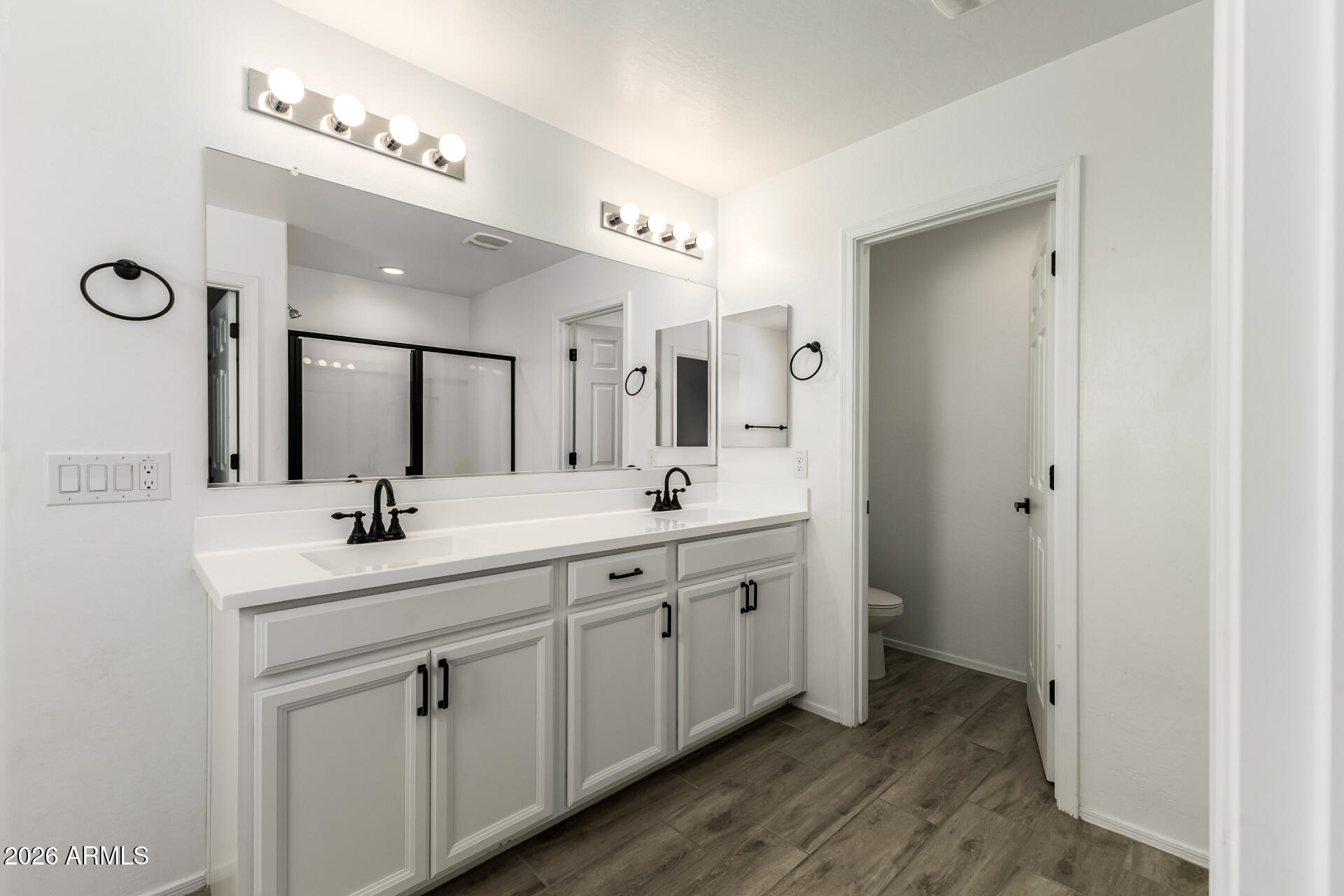 44157 West Palo Olmo Road Maricopa, AZ 85138 - Photo 19 of 34 a bathroom with a double vanity sink and a mirror