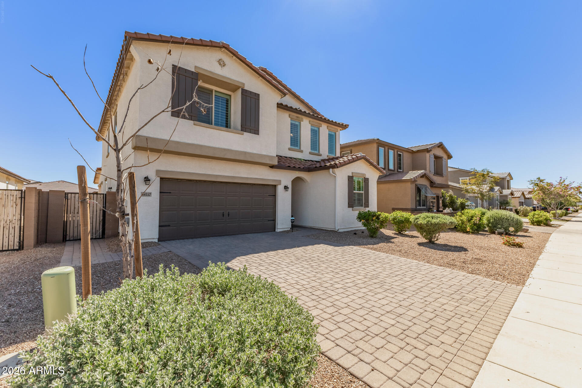 44157 West Palo Olmo Road Maricopa, AZ 85138 - Photo 2 of 34 a front view of a house with a yard