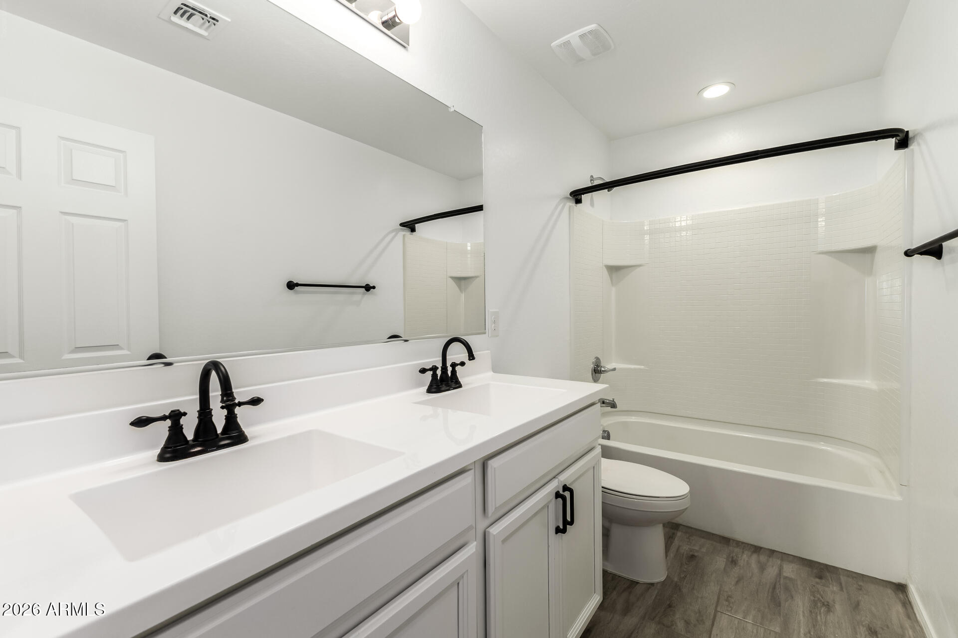 44157 West Palo Olmo Road Maricopa, AZ 85138 - Photo 29 of 34 a bathroom with a sink a toilet and a bathtub