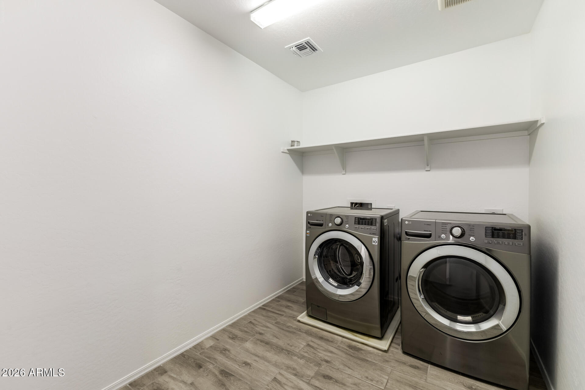44157 West Palo Olmo Road Maricopa, AZ 85138 - Photo 30 of 34 a utility room with dryer and washer