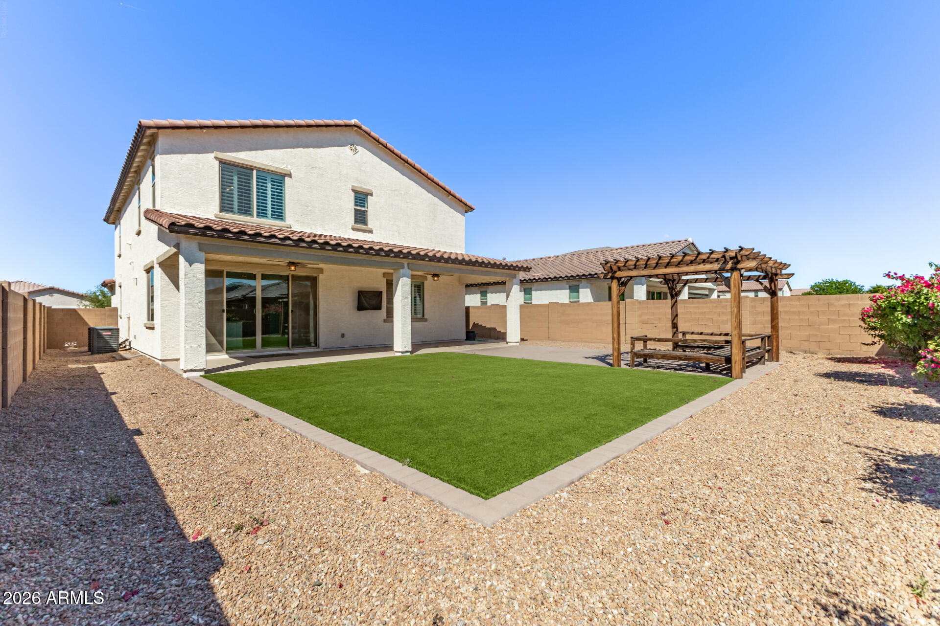 44157 West Palo Olmo Road Maricopa, AZ 85138 - Photo 32 of 34 a front view of a house with a yard and garage