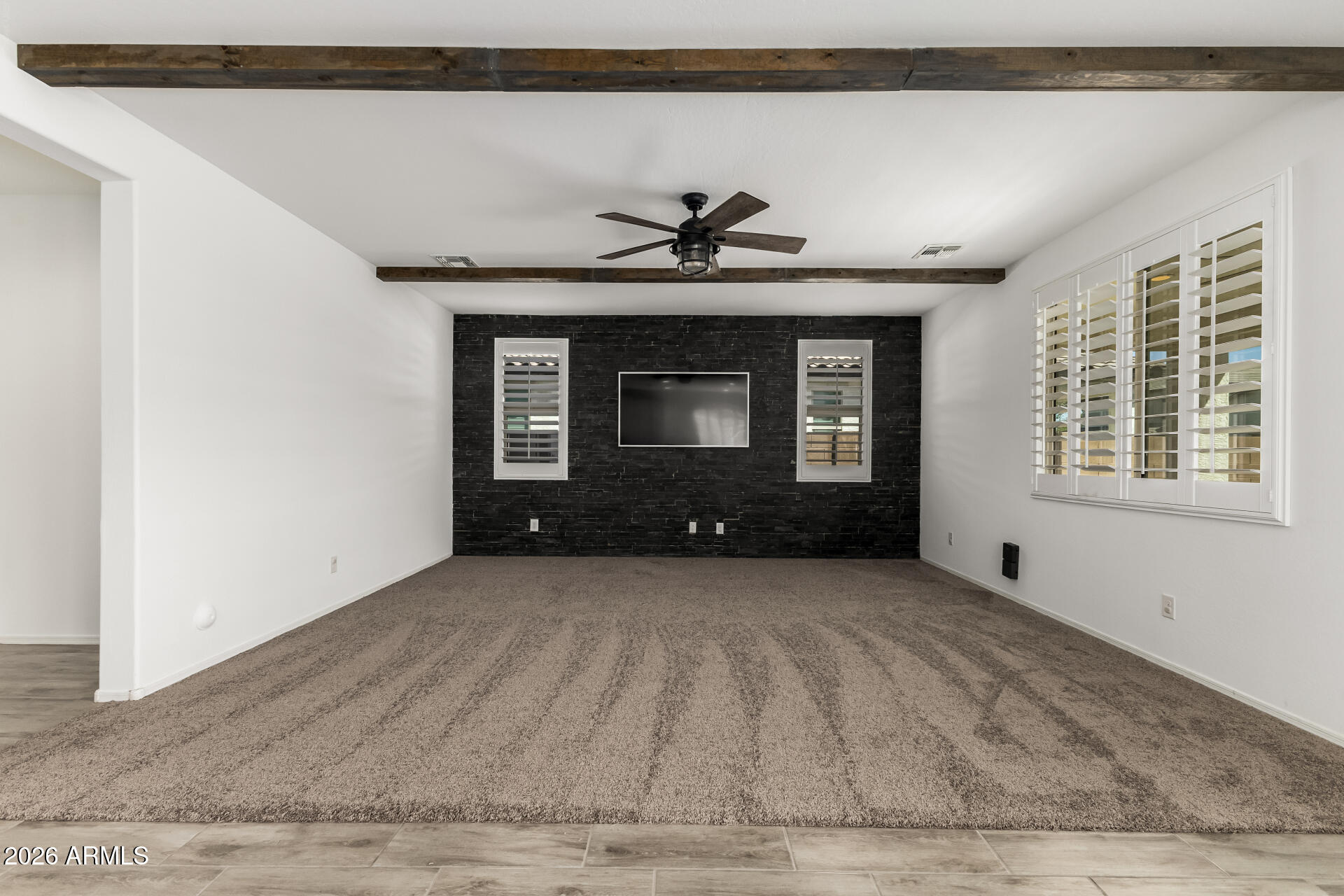 44157 West Palo Olmo Road Maricopa, AZ 85138 - Photo 4 of 34 a front view of a house with a fireplace