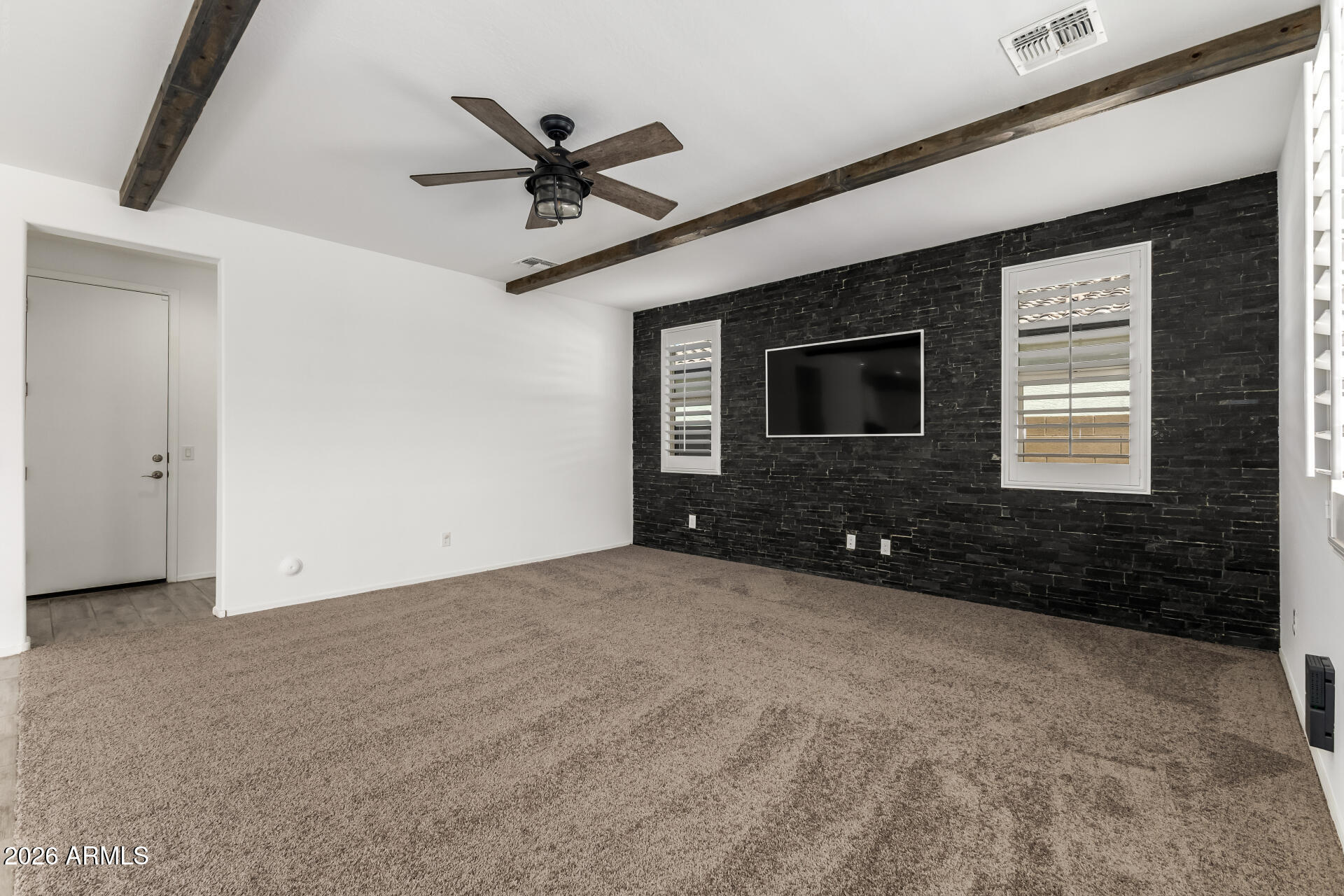 44157 West Palo Olmo Road Maricopa, AZ 85138 - Photo 5 of 34 a view of a livingroom with a ceiling fan and window