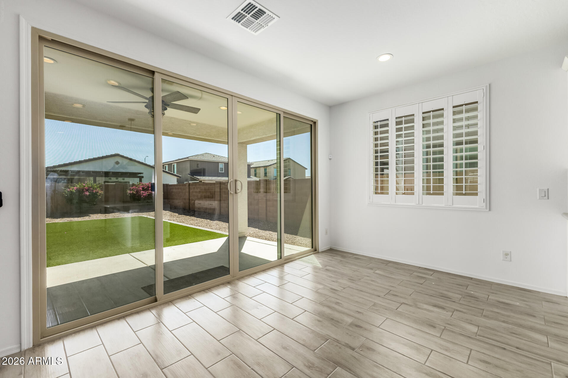 44157 West Palo Olmo Road Maricopa, AZ 85138 - Photo 8 of 34 a view of an empty room with glass door