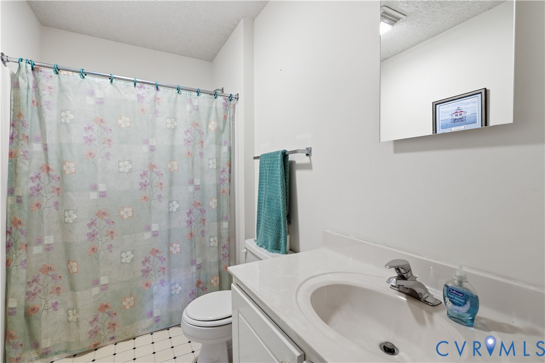 471 Knights Run Road Heathsville, VA 22473 - Photo 16 of 36 Bathroom 2 featuring a white vanity with integrate