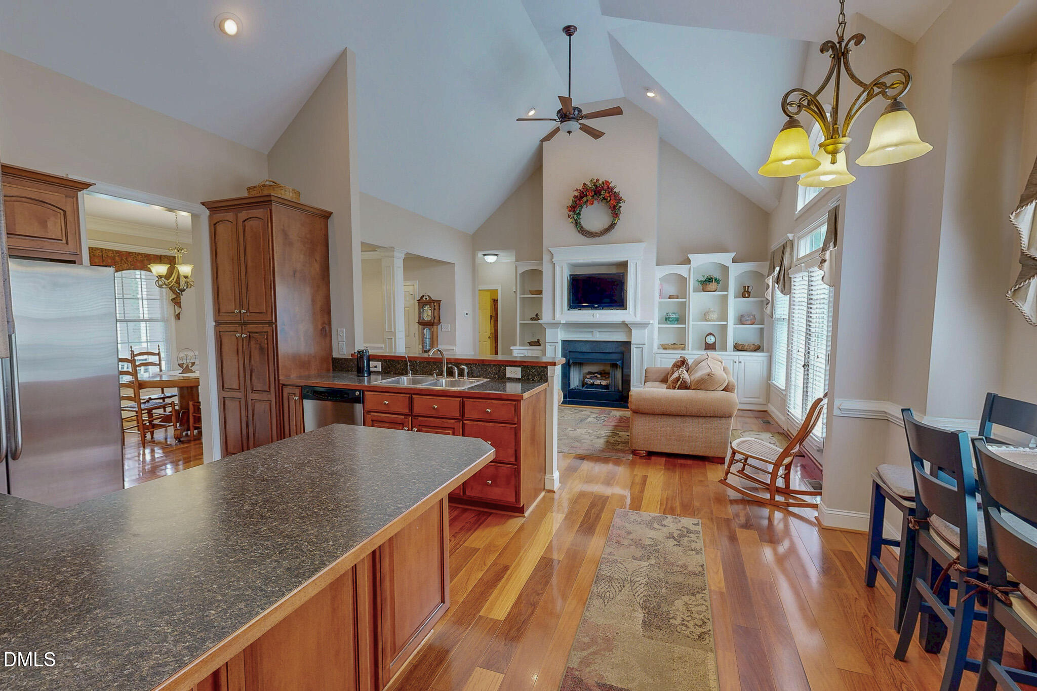 115 Duncan Plantation Road Timberlake, NC 27583 - Photo 2 of 48 a very nice looking kitchen with granite countertop a table chairs in it and wooden floor