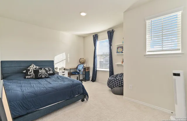 a bedroom with a bed and a dresser