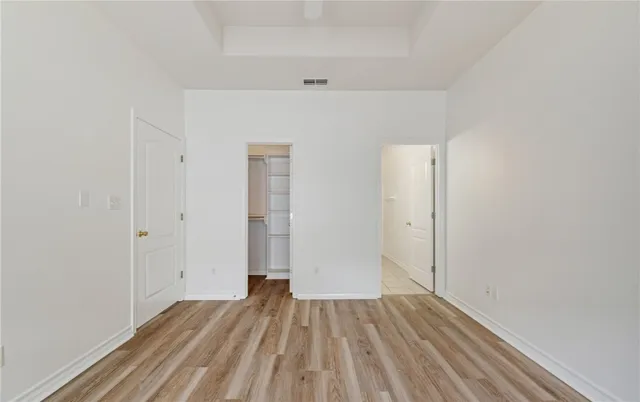 a bathroom with a bathtub shower sink vanity and a mirror