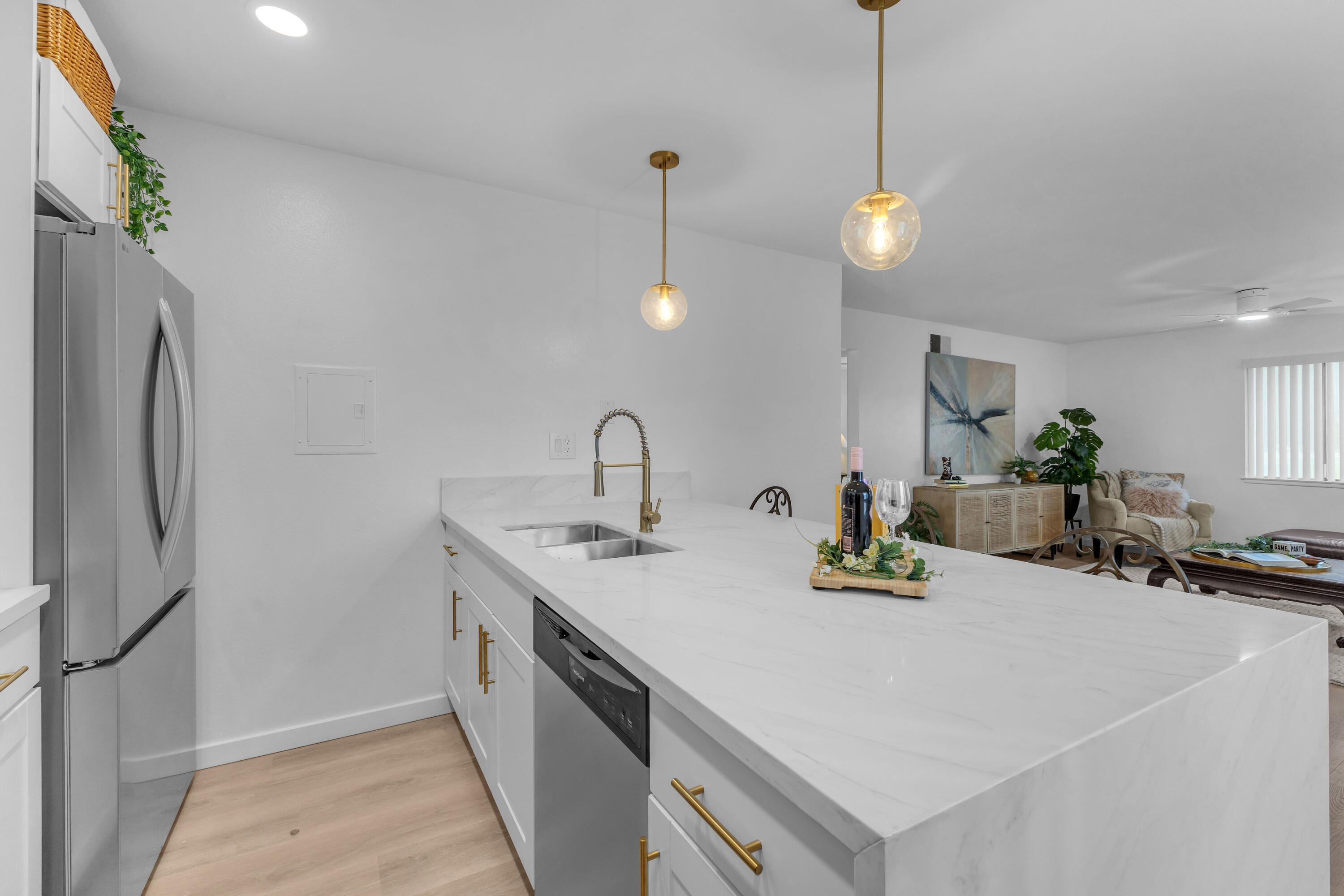 72682 Thrush Road, Unit 1 Palm Desert, CA 92260 - Photo 11 of 40 a kitchen with a sink a counter and chairs