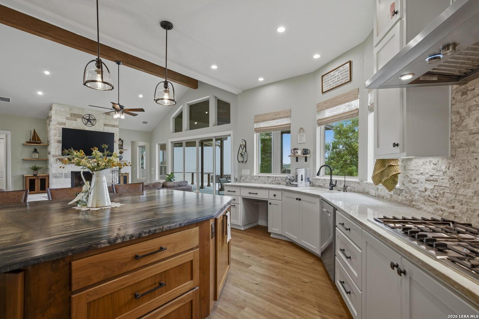 134 Stallion Estates Drive Spring Branch, TX 78070 - Photo 19 of 67 a large kitchen with stainless steel appliances granite countertop a lot of counter space and wooden floor