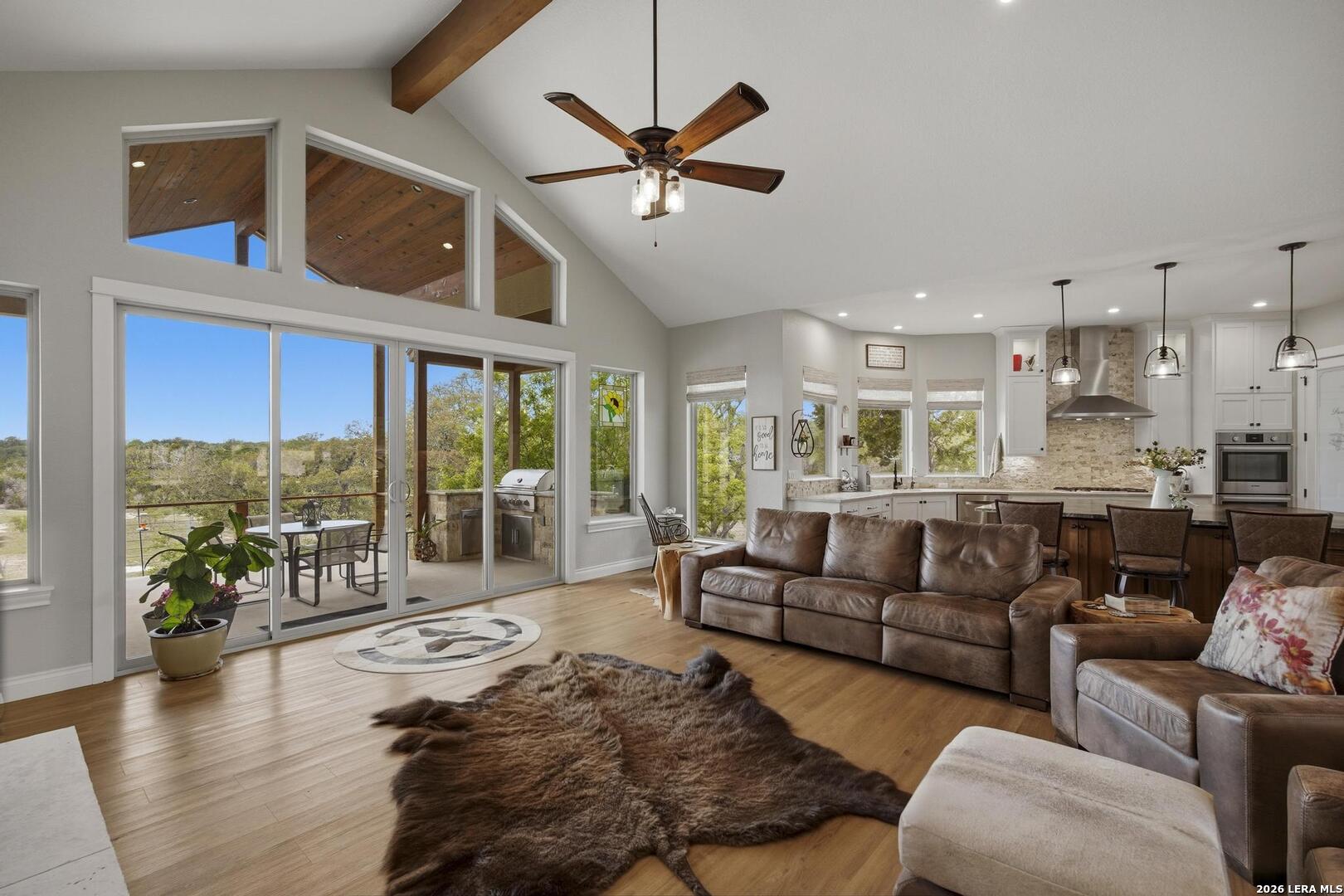 134 Stallion Estates Drive Spring Branch, TX 78070 - Photo 29 of 67 a living room with furniture ceiling fan and a large window