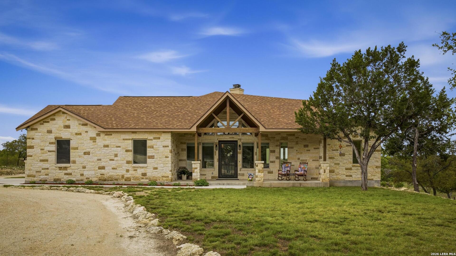 134 Stallion Estates Drive Spring Branch, TX 78070 - Photo 3 of 67 a front view of a house with garden
