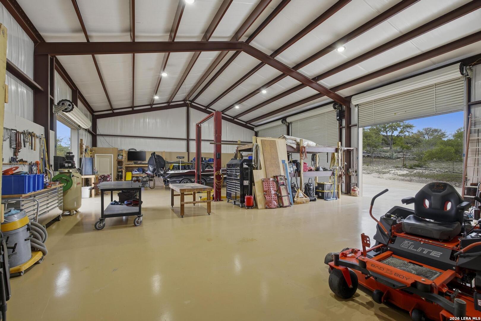 134 Stallion Estates Drive Spring Branch, TX 78070 - Photo 43 of 67 a view of a garage with lots of stuff