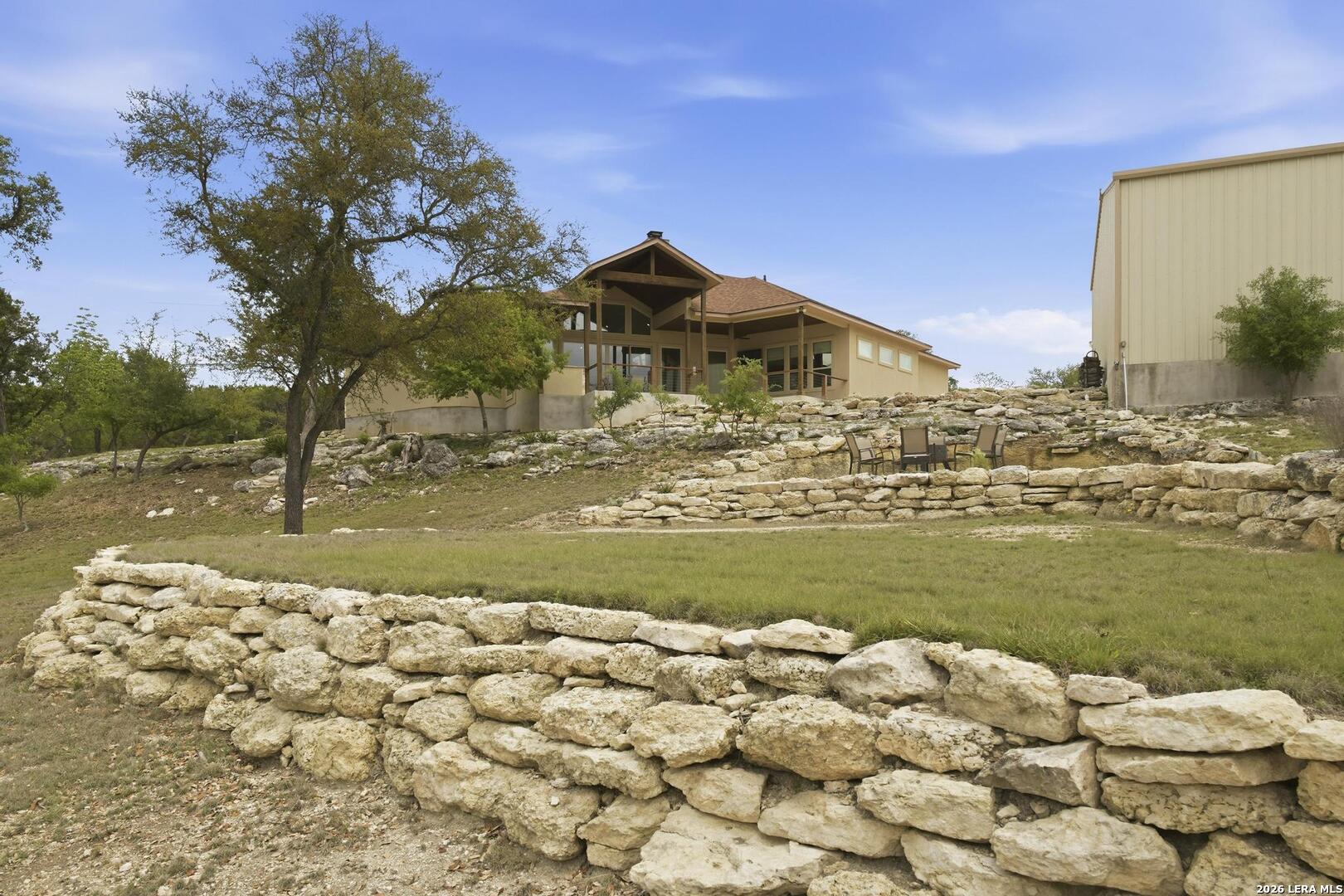 134 Stallion Estates Drive Spring Branch, TX 78070 - Photo 54 of 67 a view of a lake with a house