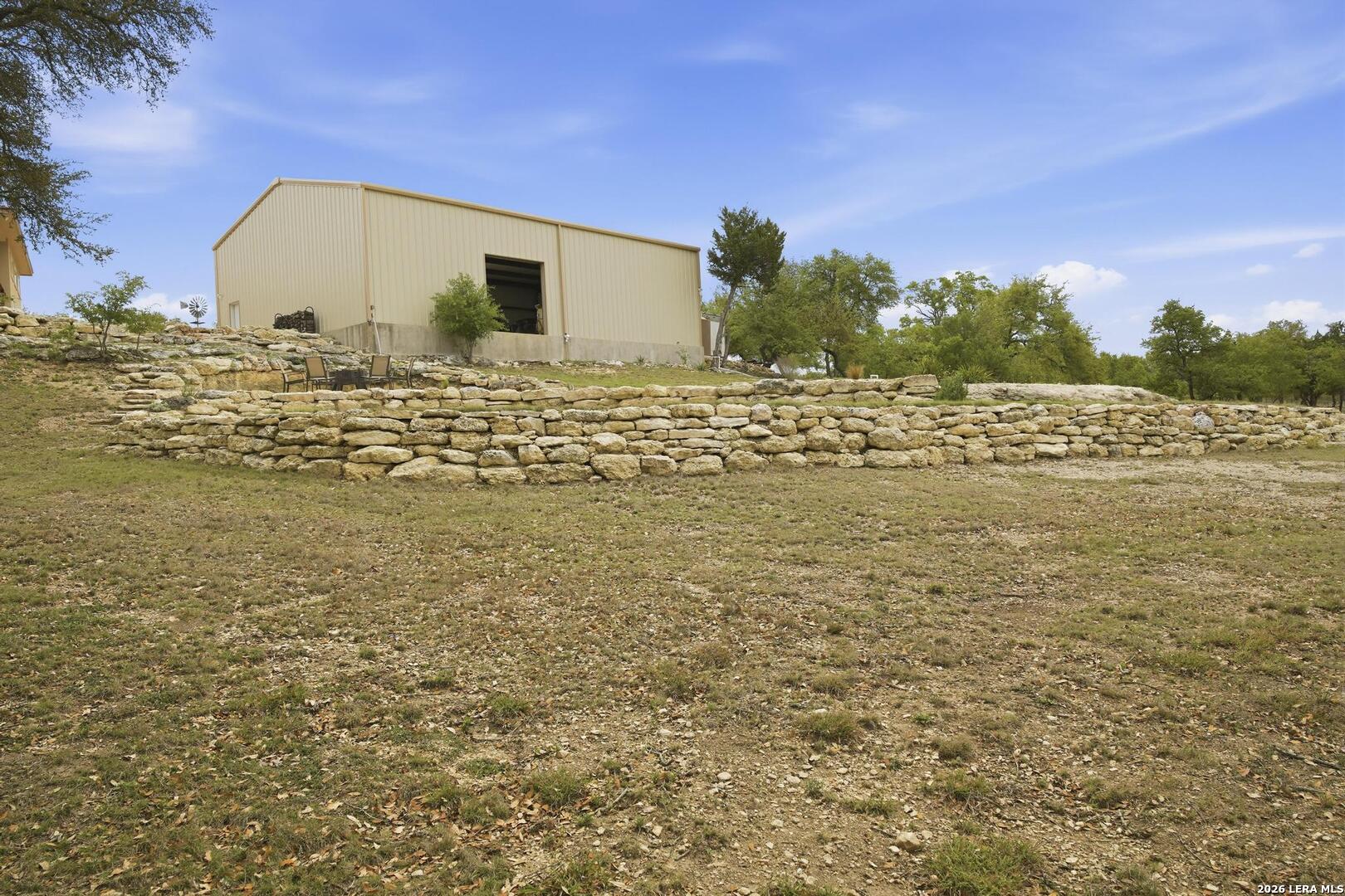 134 Stallion Estates Drive Spring Branch, TX 78070 - Photo 55 of 67 a view of a large pool with a yard