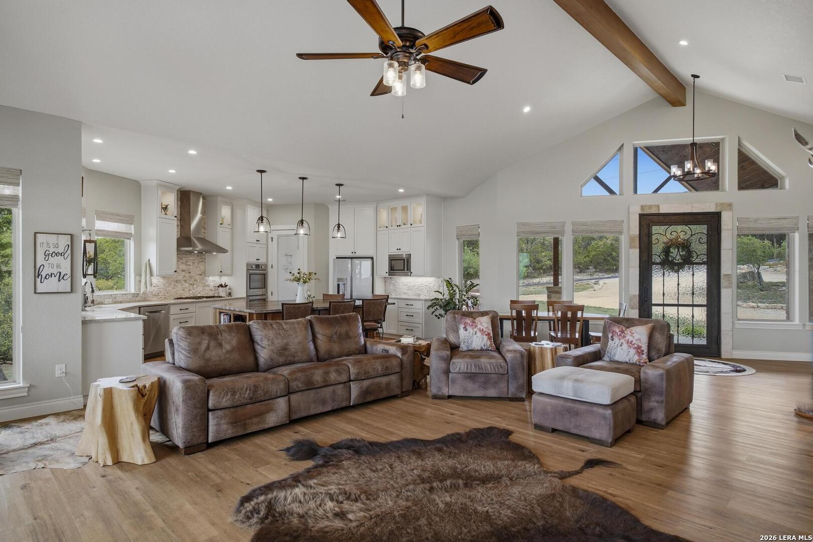 134 Stallion Estates Drive Spring Branch, TX 78070 - Photo 6 of 67 a living room with furniture and a large window with kitchen view