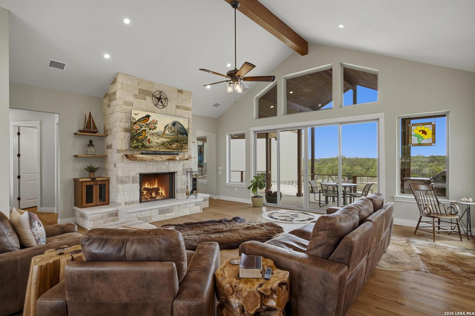 134 Stallion Estates Drive Spring Branch, TX 78070 - Photo 9 of 67 a living room with furniture fireplace and a flat screen tv