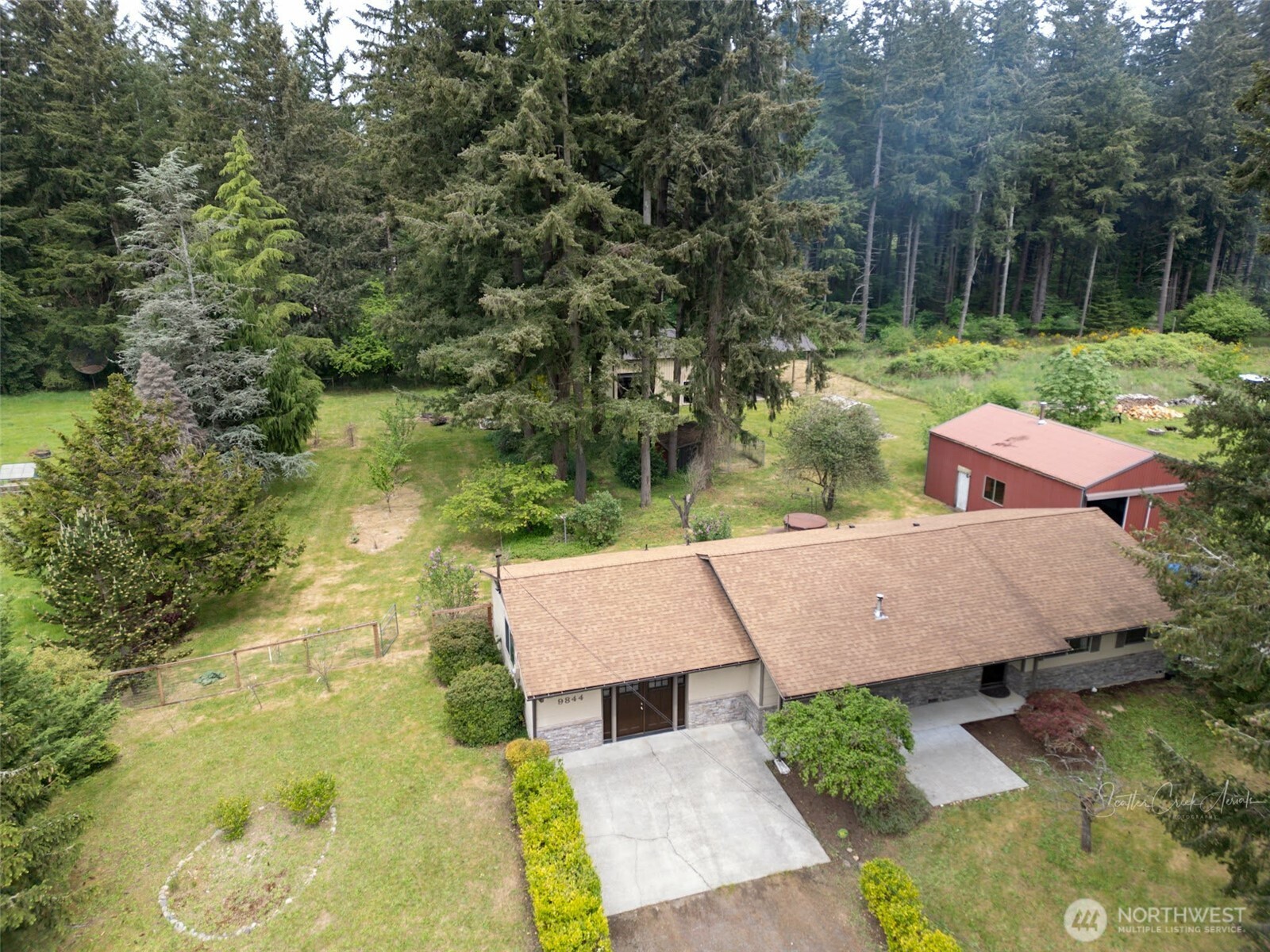 9844 173rd Avenue Southwest Rochester, WA 98579 - Photo 1 of 38 an aerial view of a house with a yard