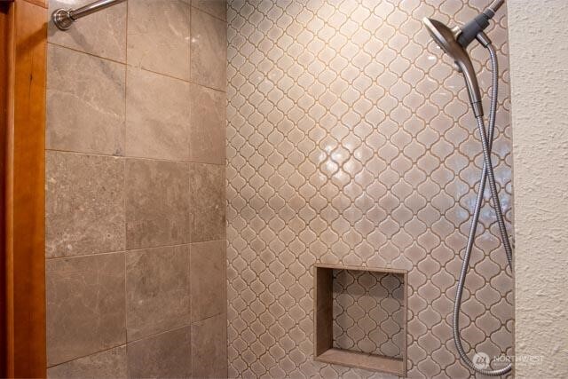 9844 173rd Avenue Southwest Rochester, WA 98579 - Photo 18 of 38 a bathroom with a shower curtain and a sink